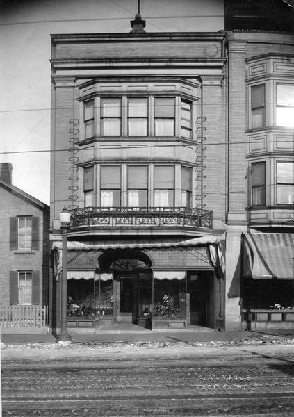 View of 214 State Street, a storefront with a shoe display in the front window.