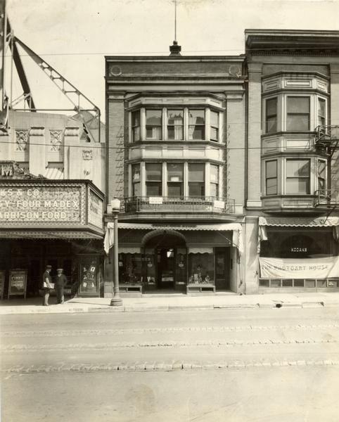 Family Shoe Store, 214 State Street. The Orpheum Theatre is to the left and the Photoart House to the right.