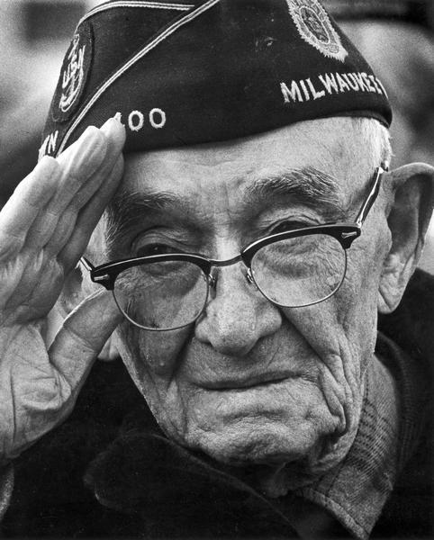 Elderly Milwaukee veteran of the U.S. Navy salutes.