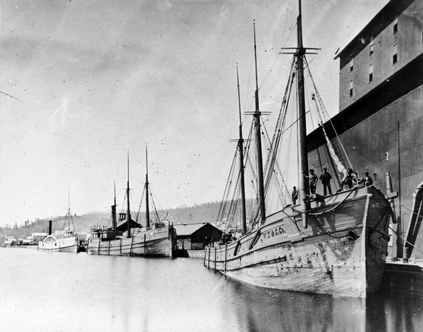 Three ships at dock, the "Superior," the "Sandusky," and the "Shawnee," all built in Gibralter, Michigan.