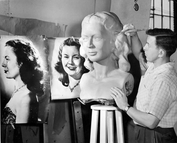 An artist sculpts a bust from photographs of Margaret McGuire, the first Alice in Dairyland, most likely to be displayed at the Wisconsin Centennial Exposition.