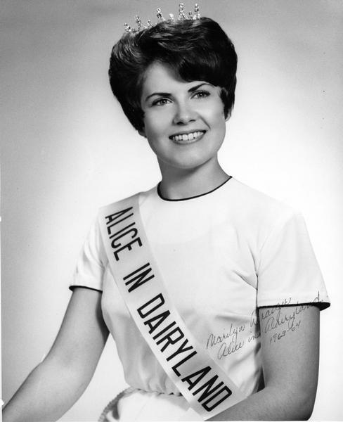 Marilyn Draeger, originally from Fort Atkinson, the 1963 Alice in Dairyland wearing a crown and her Alice sash.