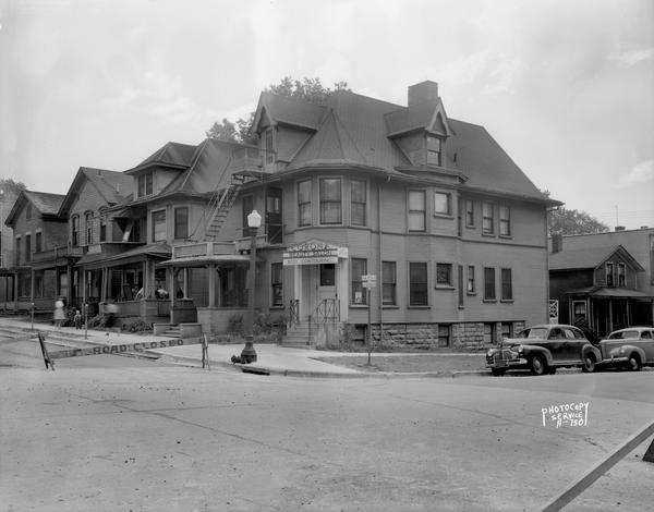 Four houses along North Fairchild Street, left to right, Michael Endres (20), Timothy Lyons (24), John Dahlk - furnished rooms (26-28), and Sam Corona (30). Also shown is the Corona Beauty Salon and Body Contouring entrance, 203 West Mifflin Street, and Mahoney Sisters Dressmakers, 205 West Mifflin Street.