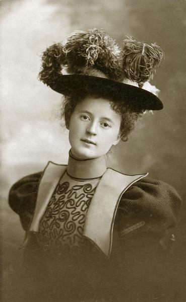 Studio portrait of Elizabeth Mills in large, feathered hat. She is the daughter of Arthur Mills and granddaughter of General Simeon Mills.