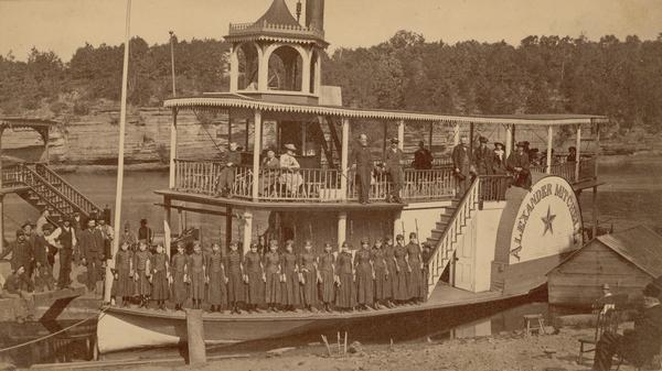 Members of the Kilbourn Broom Brigade on the <i>Alexander Mitchell</i> steamboat in the Dells. Members of the group include: Minnie Smith, Mary Sterlie, Ruth Marshall, Jinny Vanalstine, Mary Conway, Ema Bowman, Nellie Schroeder, Flora Briggs, Hattie Bennett, Mert(?) Markliener, May Henry, Rosa Bonner, Effel Howard, Hattie Snider, Maggie Conway, Nellie Bennett, Flora Loomis, Annie Wisner.