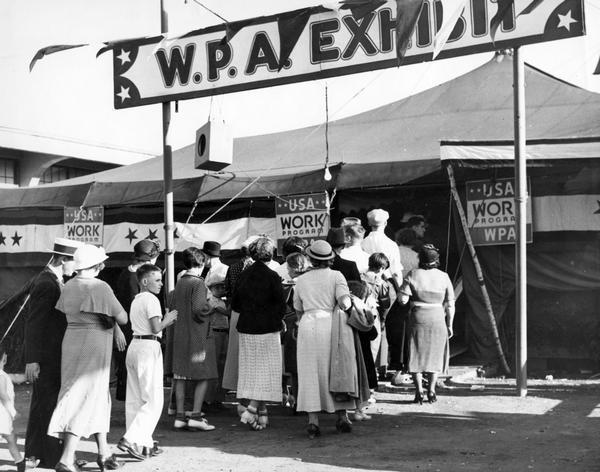 Fair-goers stand in line to enter the W.P.A. Exhibit tent at the Wisconsin State Fair.