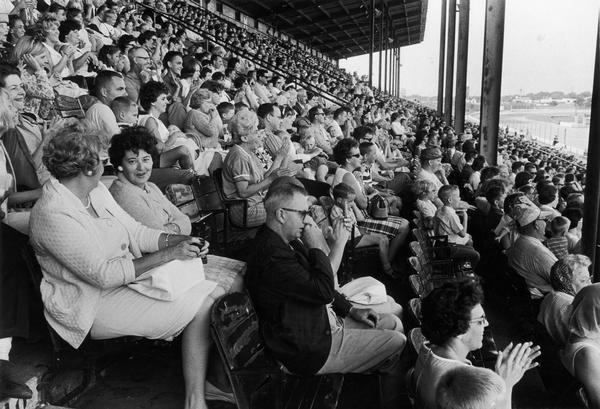 Fans at a baseball stadium watching an Andy Williams show.