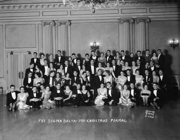 Phi Sigma Delta Christmas formal in the Crystal Ballroom at the Loraine Hotel, 119 West Washington Avenue.