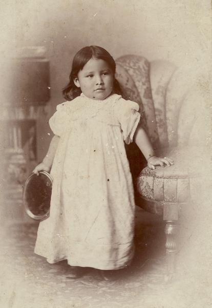 Studio portrait of Zintka Lanuni ("Lost Bird") Colby, a Lakota, who as an infant survived the Battle of Wounded Knee in 1891.