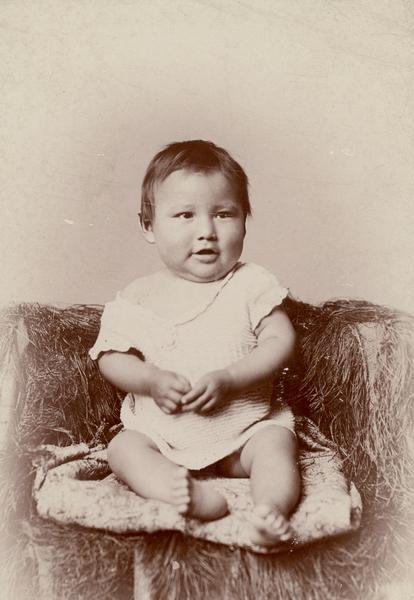 Studio portrait of Zintka Lanuni Colby as a baby.