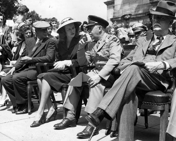 Marge Bong talks with General Kenney on the Wisconsin State Capitol steps at the Major Richard Ira Bong (1920-1945), Memorial dedication, Memorial Day.