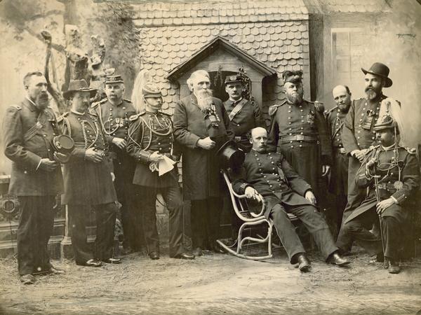 Wisconsin Governor Jeremiah M. Rusk and his staff at the funeral of General Ulysses S. Grant in New York City.  Present with Rusk, 5th from the left, and in dress uniforms were: Col. Chas. King, Acting Chief of Staff; Brig. Gen. Henry Palmer, Surgeon General; Brig. Gen. E. M. Rogers, Quarter Master General; Col. W. C. Bailey, Judge Advocate General; Col. W. S. Stanley; Col. C. E. Morley; Col. N. R. Nelson; Col. E. E. Clough; Col. John Hicks; and Lt. Col. F. A. Copeland, Asst. Inspector General.