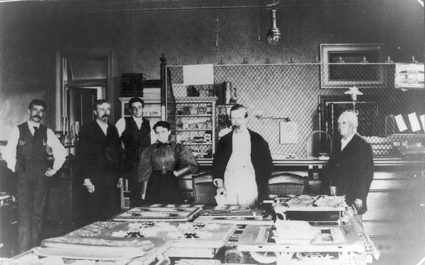 Officials and staff of Madison City Gas, Light & Coke Company (currently MG & E) at its Main Street office. From left to right are Henry L. Doherty (MG&E first general manager), John Corscot, Walter Kropf, Anna Fiedler, George Whare, and Dr. Charles Riesbam.