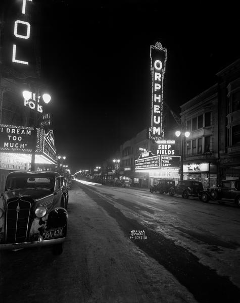 The Orpheum Theatre canopy and sign at night on the 200 block of State Street. The Orpheum Theatre marquee notes: "Shep Fields" on stage, and "Kind Lady" on screen. The Capitol Theatre marquee across the street advertises: "I Dream Too Much."