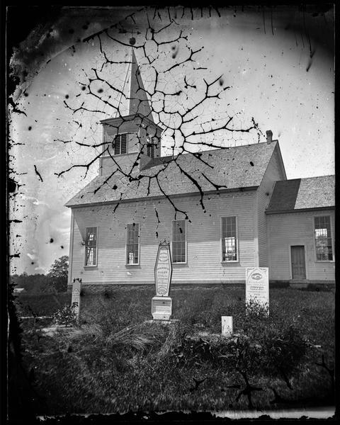 East Blue Mounds Lutheran Church, formerly Norsk Evangelisk Kirke, built in 1868.  The graves of Andreas L. Dahl's mother, Berthe Nelsdatter (Lund) Dahlen, center and her sister, right are in the foreground.