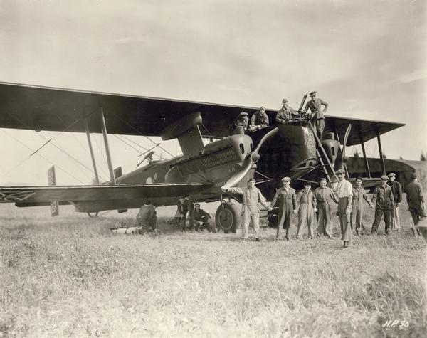 A vintage German Gotha airplane brought to Hollywood by Howard Hughes for use in "Hell's Angels," together with members of the Caddo Company's film crew and several members of the cast in the plane.  At the time the Gotha was the largest airplane to have appeared in a motion picture.  In the film storyline, the plane was captured by two British aviators to bomb a German munitions dump, one of many dramatic and authentic scenes in "Hells Angels."  See Image ID#28295 for another view of this plane.