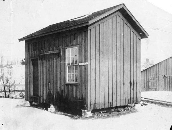 Building housing the very first central electric light station for distribution of incandescent lighting. The sign on the building reads: "Vulcan St."