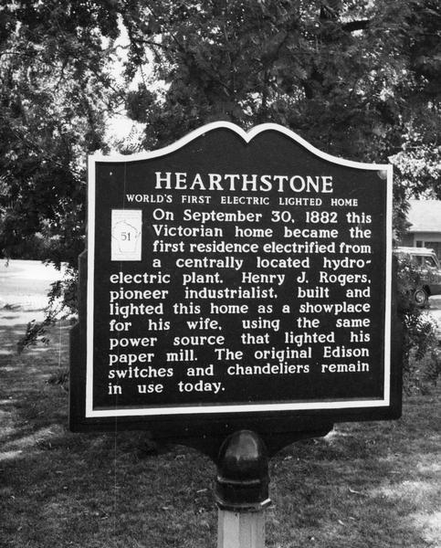 Plaque describing "Hearthstone," the home built by paper mill owner, Henry J. Rogers. The residence was the first dwelling electrified from a centrally located hydorelectric plant.