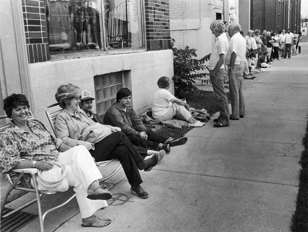 People waiting in line for the opportunity to buy tickets to a Green Bay Packers home game.