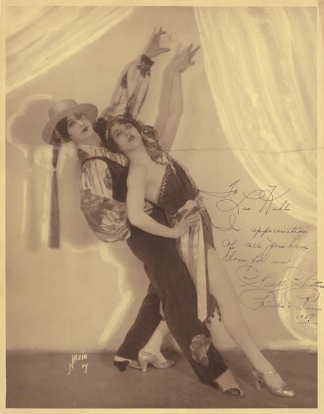 The Sidell Sisters, Billie and Pierre, posed as a Latin couple. The Sidell Sisters were from Madison, Wisconsin. They were students of Leo T. Kehl and they later performed a the Folies Bergere in France. Billie later joined the faculty at the Kehl School of Dance, and taught Jo Jean and Jo Ann Kehl.