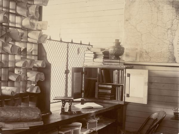 Interior view including traveling library station with map of Wisconsin on the wall.