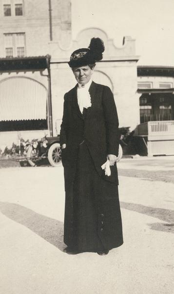 Candid outdoor portrait of Lutie E. Stearns, signed on the back: "yours unto death and after, Lutie E. Stearns".
