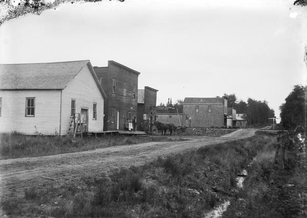 Main Street with William Fehrmann's Saloon and Boarding House.