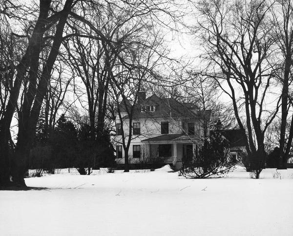Exterior winter view of the Osborn house. Mrs. Delaware Osborn, daughter-in-law of Joseph H. Osborn, resides there.
