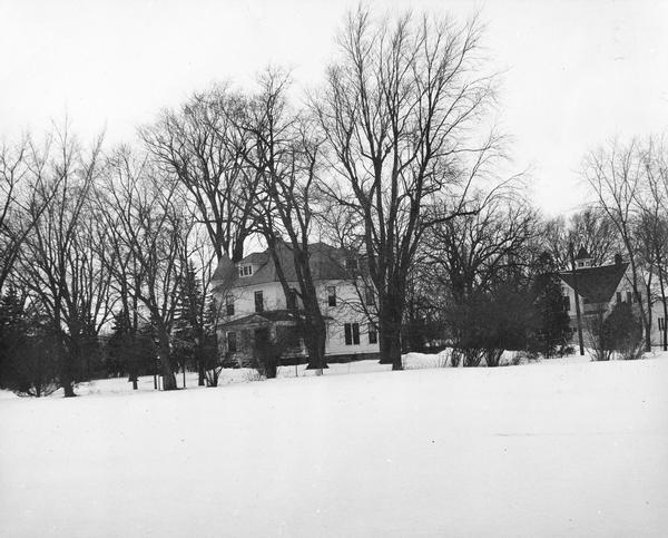 Exterior view of the Osborn house with the barn behind it.