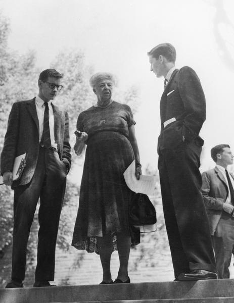 Candid view of Ray Farabee, Eleanor Roosevelt and George Embry with unidentified man in the background.