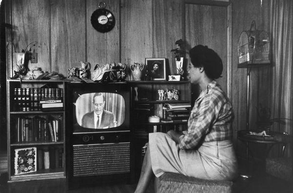 Daisy Bates watching Governor Faubus on television.