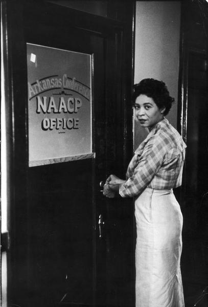 Daisy Bates, president of the Arkansas NAACP chapters, at the door of the organization's office. She headed the integration effort during the crisis at Central High School in 1957.