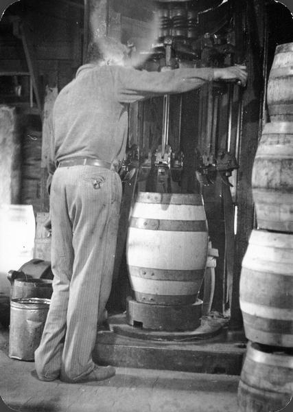 Joe Hess installing finishing hoops on a barrel at the Hess Cooperage.