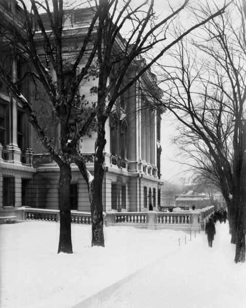 Exterior view of the Wisconsin Historical Society. South side from the corner of Park and State Streets. Snow is on the ground.