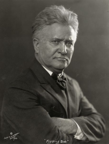 Portrait of Senator Robert M. La Follette, Sr., taken by John A. Glander, a noted portrait photographer from Manitowoc, Wisconsin.  In this portrait with his arms crossed and his jaw set, Senator La Follette so epitomizes his reputation as "Fighting Bob" that the photographer used it to label the portrait.