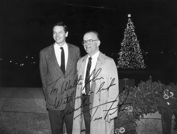 Wisconsin Republican Congressman Thomas Petri and State Senator Walter John Chilsen pose in front of the national christmas tree. The tree came from Northern Wisconsin. Chilsen was a Republican state senator from Wausau, 1967-1991. He was prominent in committee work on aging, agricultural and rural development, health care, consumer credit reform, and University of Wisconsin system merger. He was also a leader of Senate Republican Caucus, 1967-1972.