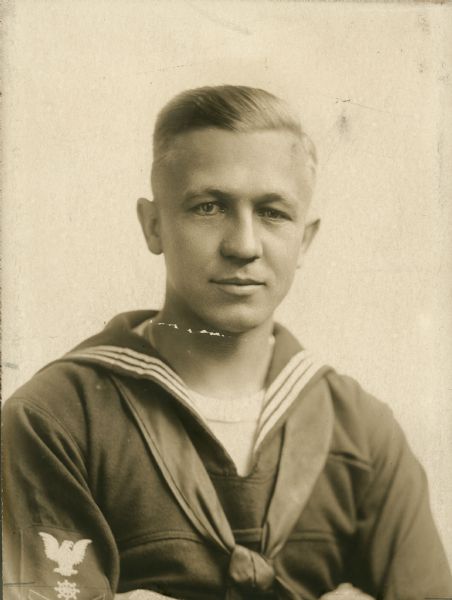 Portrait of young Oscar Rennebohm in his World War I Navy uniform. Rennebohm interrupted his already successful career as the owner of the Badger Pharmacy in Madison to volunteer in 1917.  After his return in 1920 Rennebohm developed that pharmacy into the Rennebohm chain.