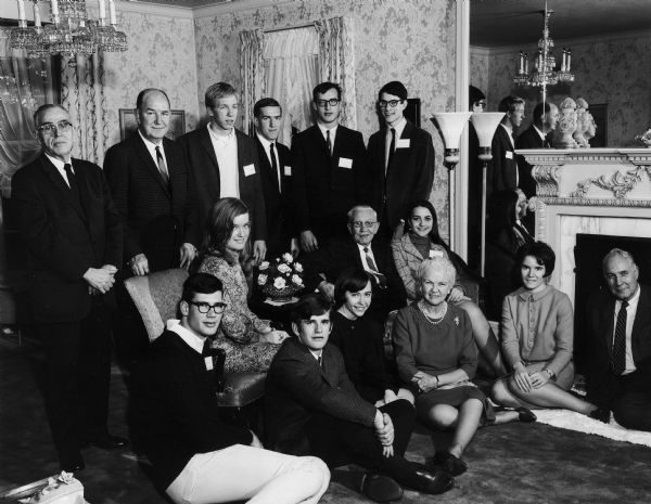 Former Governor and Mrs. Rennebohm pose with Rennebohm scholars and committee members. Back row, left to right: Dean Uhl, John Walsh, Terry Geurkink, Ronald Nohr, Karl Zart, and Ronald Richgels. Middle row, left to right: Robert Harris, Sheridan Ash, Oscar Rennebohm and Lynn Buckley. Bottom row, left to right: Ralph Chapman, Sandra Brecke, Mary Rennebohm, Jean Heinze, and Dean Luberg.