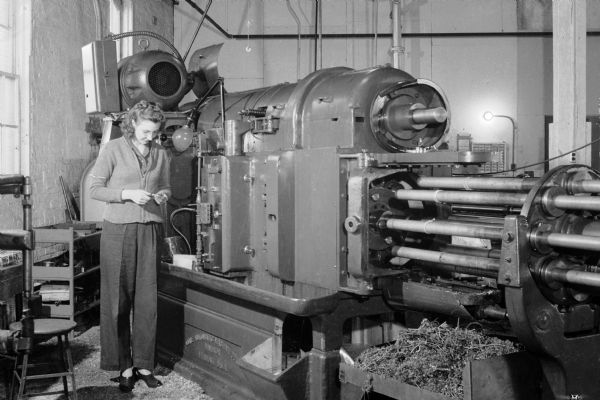 A woman operates a lathe at the Gisholt plant on East Washington Avenue.