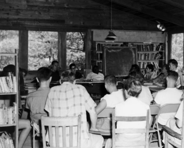 A Civil Rights workshop in session at Highlander School showing Myles Horton, Mikii Marlowe, Essau Jenkins, Septima Clark and Rosa Parks in attendance.