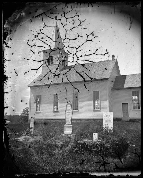East Blue Mounds Lutheran Church, formerly Norsk Evangelisk Kirke, built in 1868. The graves of Andreas L. Dahl's mother, Berthe Nelsdatter (Lund) Dahlen, center and her sister, right, are in the foreground.