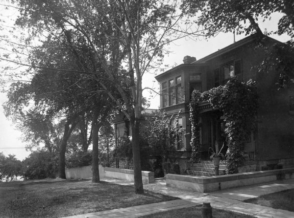 Exterior view of the Fairchild House at 302 South Wisconsin Avenue (renamed Monona Avenue in 1877) at W. Wilson St. near Lake Monona. The house was constructed in 1850 by Jarius Fairchild and was substantially altered with additions. After the Civil War, the house became the home of Fairchild's son, Lucius, Civil War hero, Wisconsin governor (1866-72) and foreign diplomat. During his six years as governor, the Fairchild House was the state's executive residence, as no such property was then owned by the state. The residence was therefore a focus of Madison's political and social life during the last half of the 19th century.