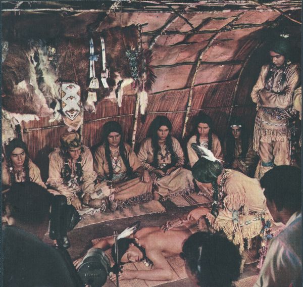 Actors in Indian costume as seen in the film "Mishaskwut," which depicts the life of the Menominee Indians. The film was sponsored by the Wauwatosa Board of Education.