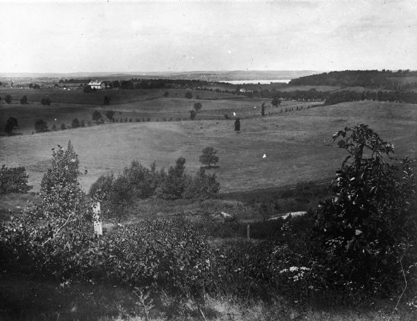 View from Sunset Point in Owen Park, which is now a part of Hoyt Park. Lake Mendota is in the distance.