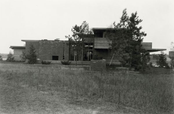 Schwartz house exterior with trees in the front.