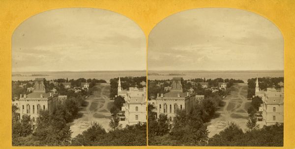 Stereograph of an elevated view of Wisconsin Avenue with Lake Mendota in the background.