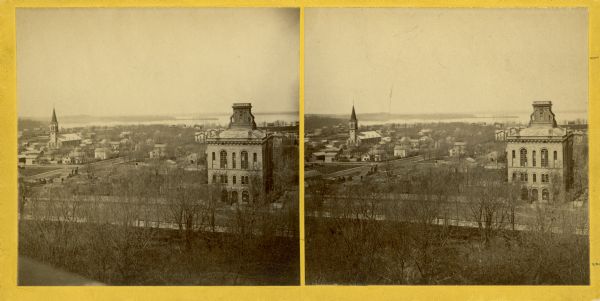Stereograph of Madison looking northwest from the top of the Capitol. City Hall is featured in the foreground.