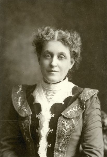 Waist-up portrait of Carrie Chapman Catt, one of the best known leaders of the women's suffrage movement who had strong ties to the North Country and who once "inflamed" the countryside with her oratory.

Carrie Lane was born in Ripon, Wisconsin, on January 9, 1859, the daughter of Lucius Lane and Maria Clinton Lane. Both of her parents had graduated from Potsdam Academy, and several generations of the Lane family had farmed the family homestead in West Potsdam, NY for many years. Lucius and Maria had gone west in 1855, soon after their wedding, but both families remained well-known locally. Catt's girlhood home is the site of the future Carrie Chapman Catt Museum.

Carrie worked as an organizer for the National American Woman Suffrage Association from 1890 to 1900, when she became its national president. She led the campaign to win women's suffrage with a federal amendment to the constitution until 1920 when the 19th amendment was ratified.