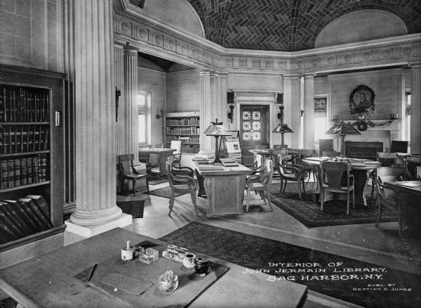 Interior view of the John Jermain Library reading room in Sag Harbor, New York. Text on photograph reads: "Interior Of John Jermain Library, Sag Harbor, N.Y. Publ. By Keating & Jones"