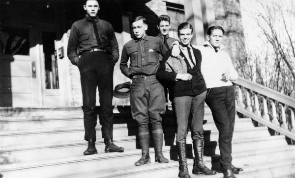 Spencer Tracy and four of his friends pose on the steps of West Hall at Ripon College sometime between February 1921 and March 1922. Tracy is on the far right with his arm around Kenneth Edgers. The other men are identified only as "some of the West gang".